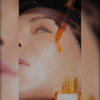 Close-up of a dropper with a serum being applied to a person&
