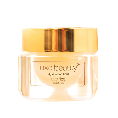 Luxe Beauty Lip Plumper product with gold cap on a white background