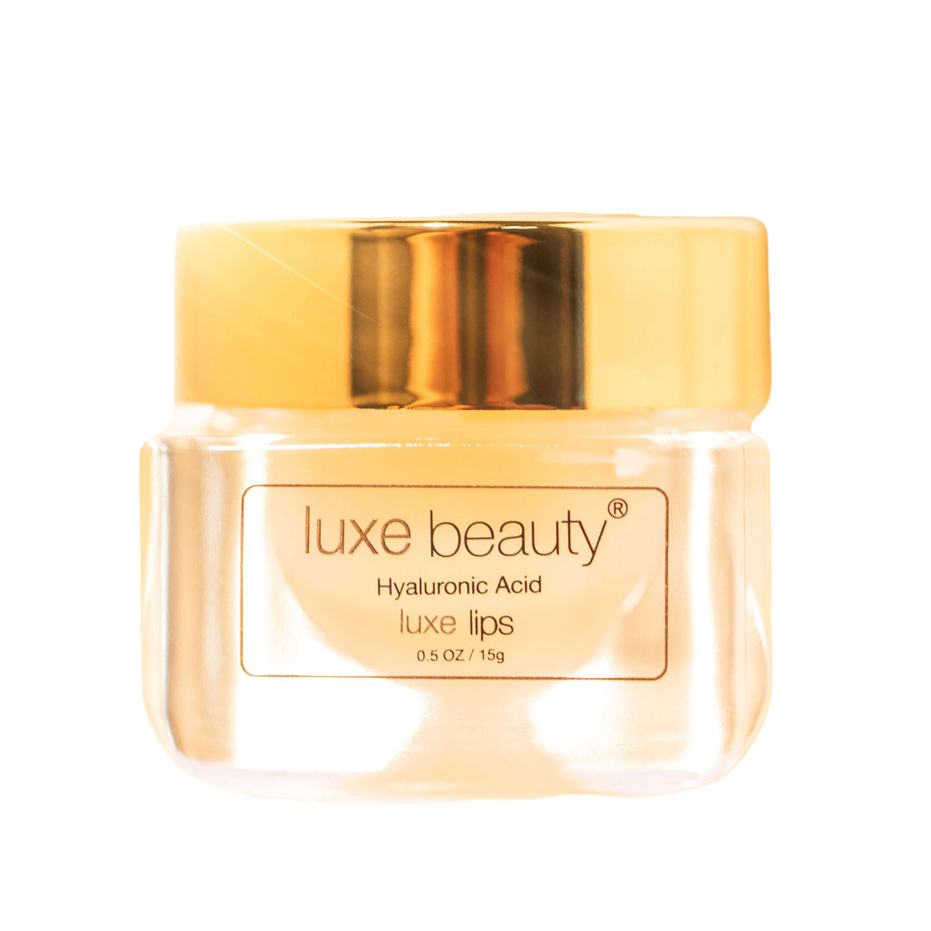 Luxe Beauty Lip Plumper product with gold cap on a white background